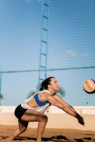 Elbow pad cushioning a volleyball player's arm as they dive for a save.