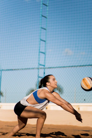 Elbow pad cushioning a volleyball player's arm as they dive for a save.
