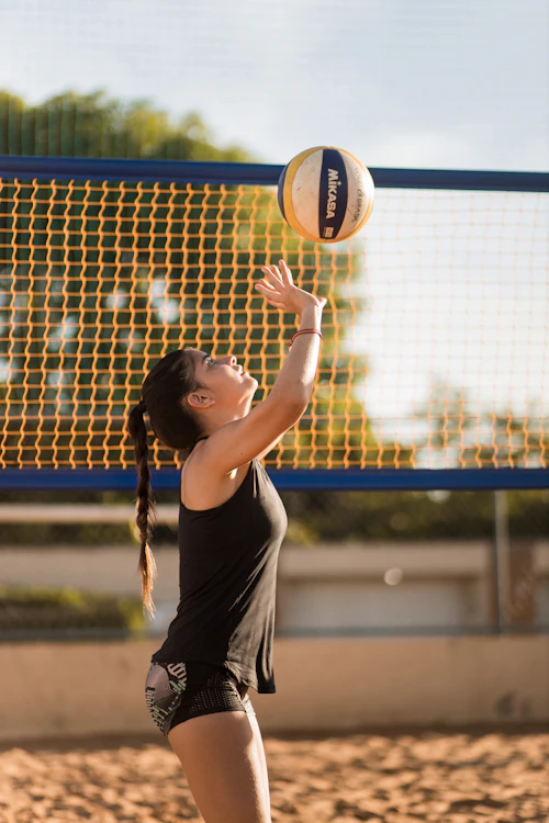 Player reaching up to throw the ball