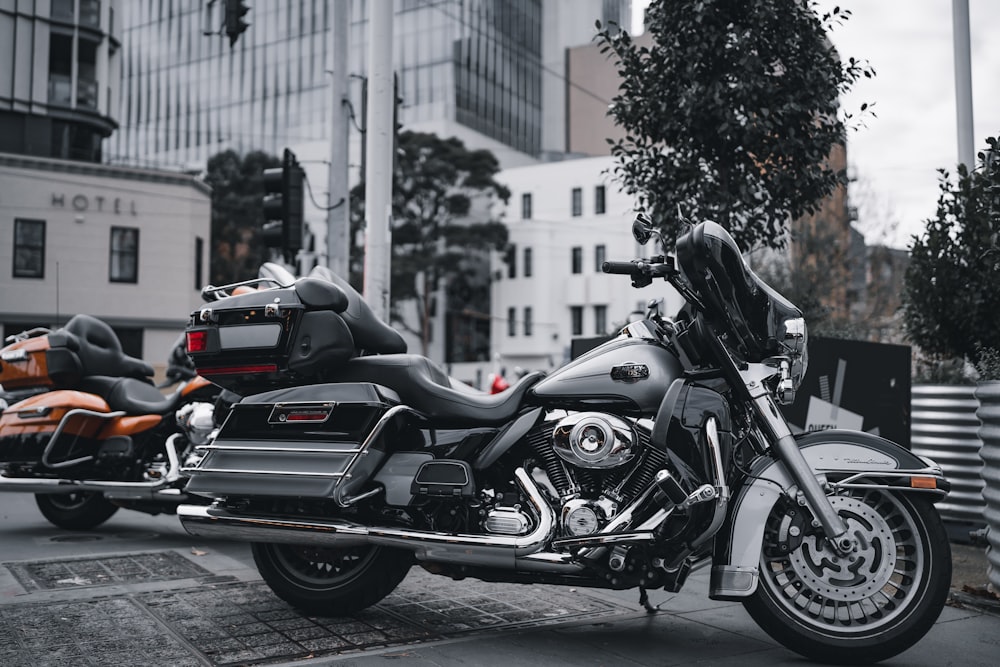 a couple of motorcycles parked on the side of the road