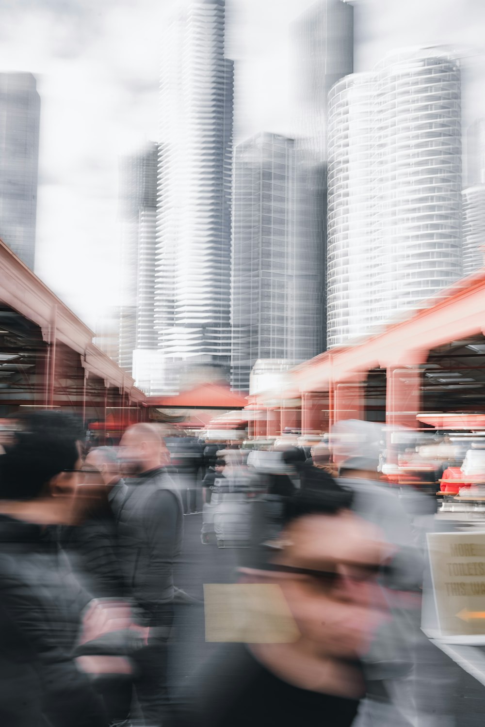 a blurry photo of people walking in a city