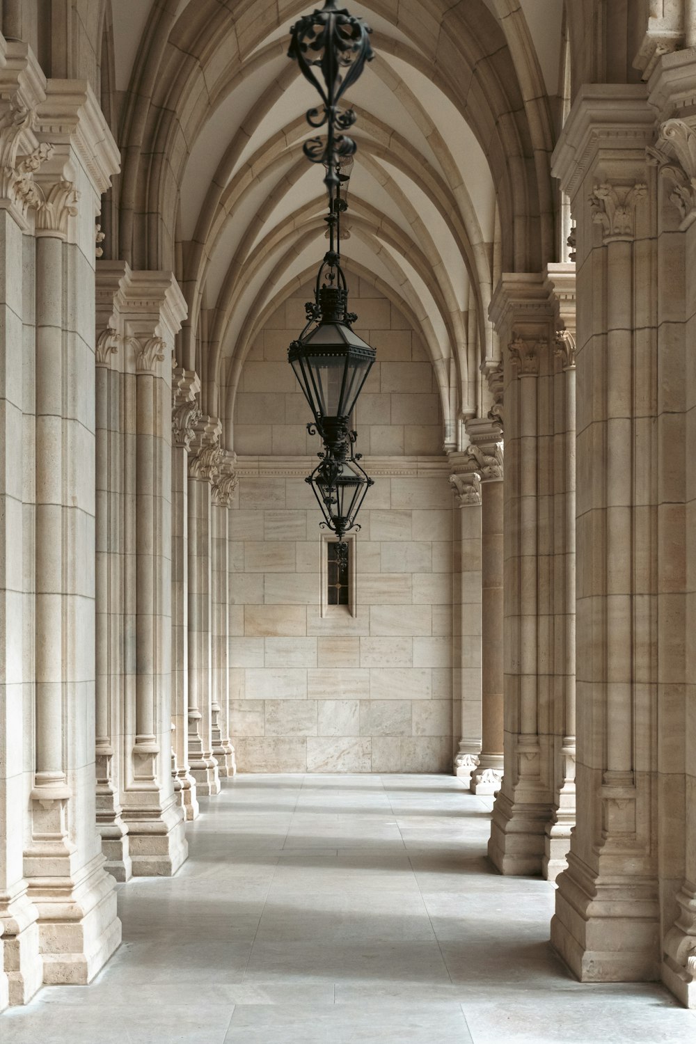 a long hallway with a light hanging from the ceiling