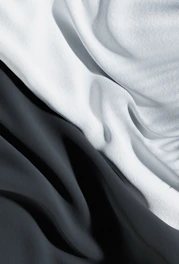 An abstract photo of flowing fabric creating soft, organic shapes.