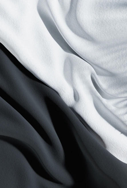 An abstract close-up of textured fabric flowing gently in the breeze.