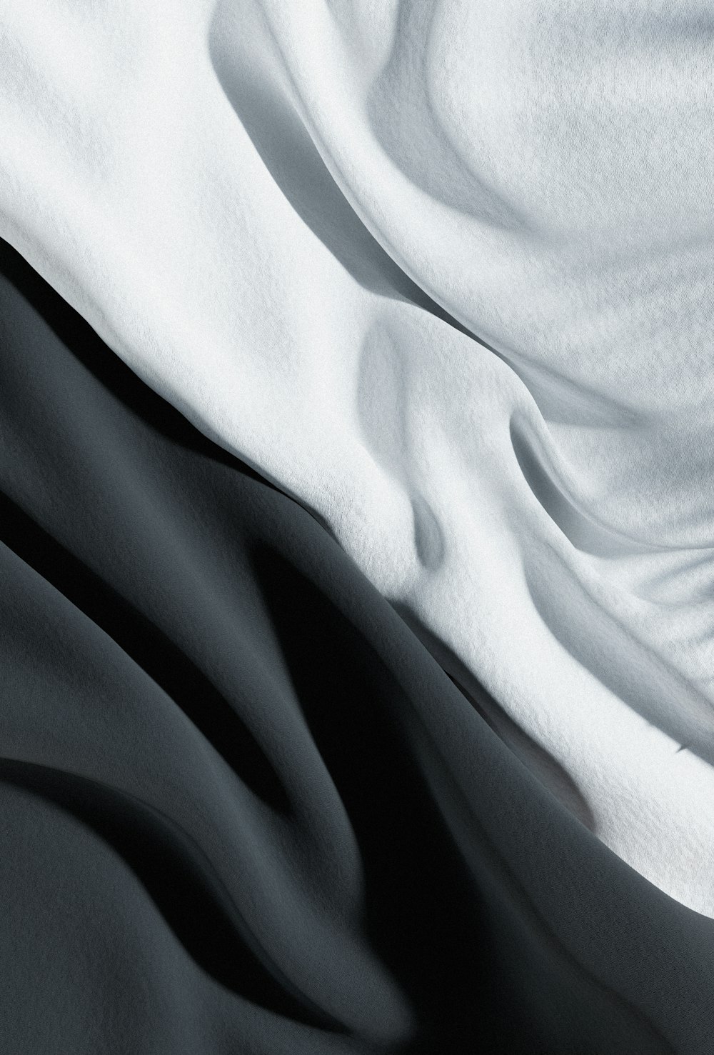 a black and white photo of a bed sheet