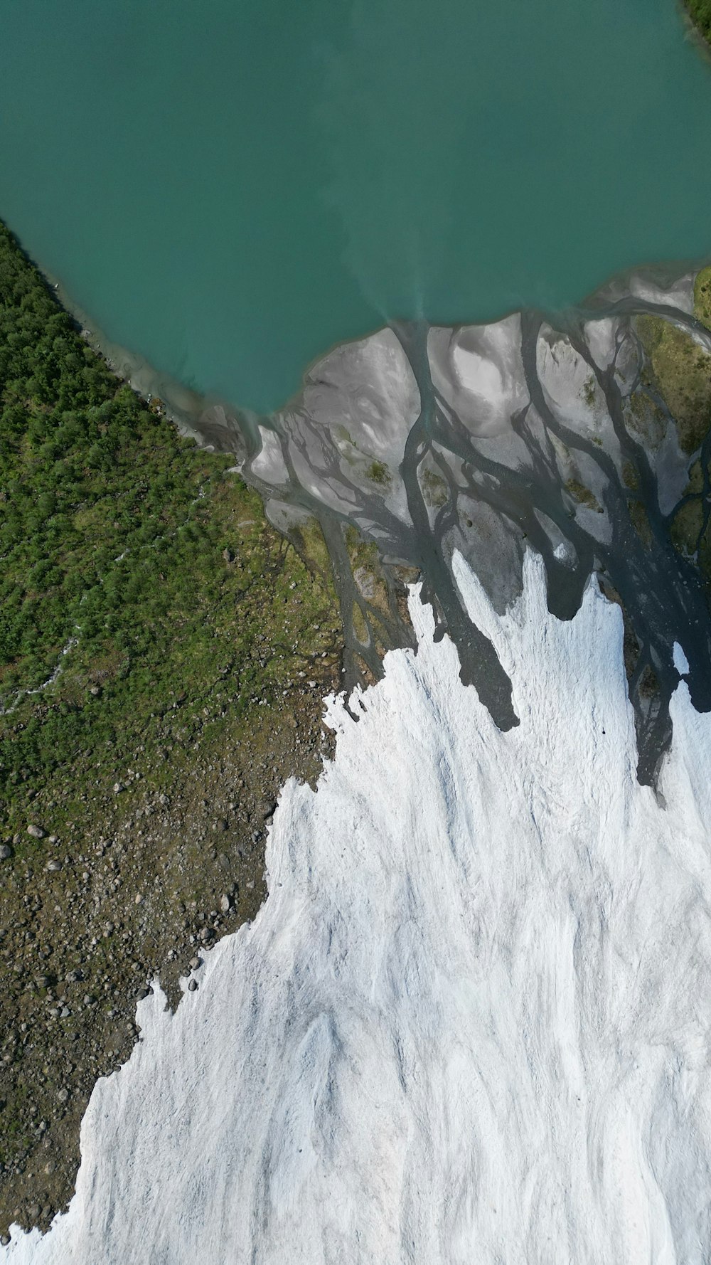 an aerial view of a snow covered mountain
