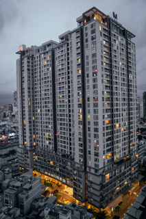 A well-lit apartment building near central Kanpur market.