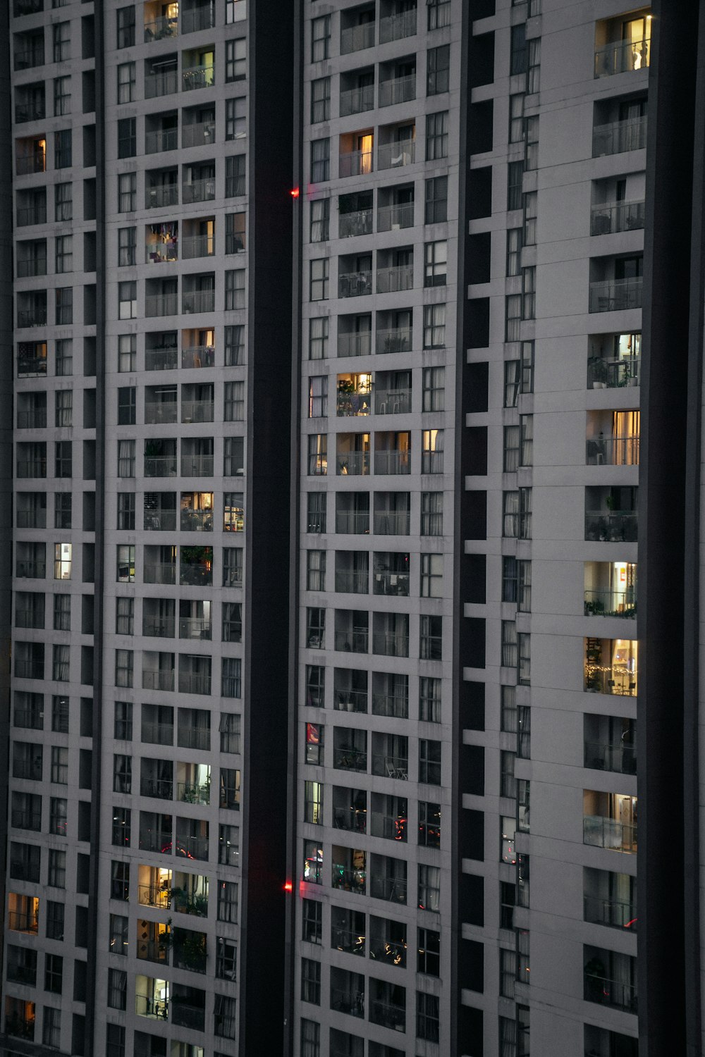 a very tall building with lots of windows at night