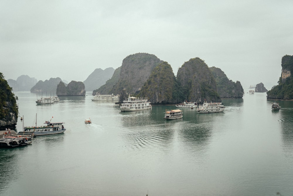 a group of boats floating on top of a body of water