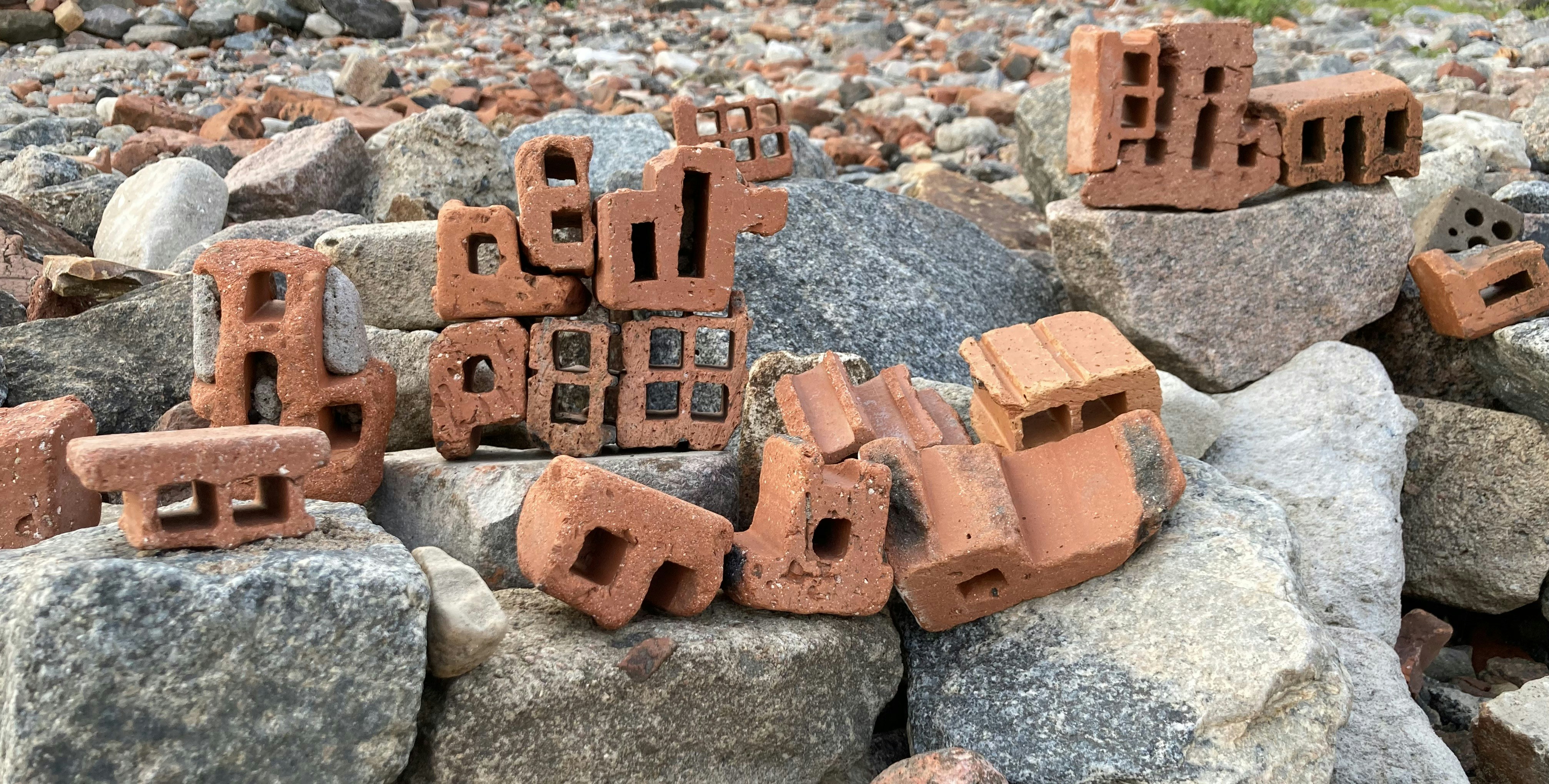 a pile of bricks sitting on top of a pile of rocks