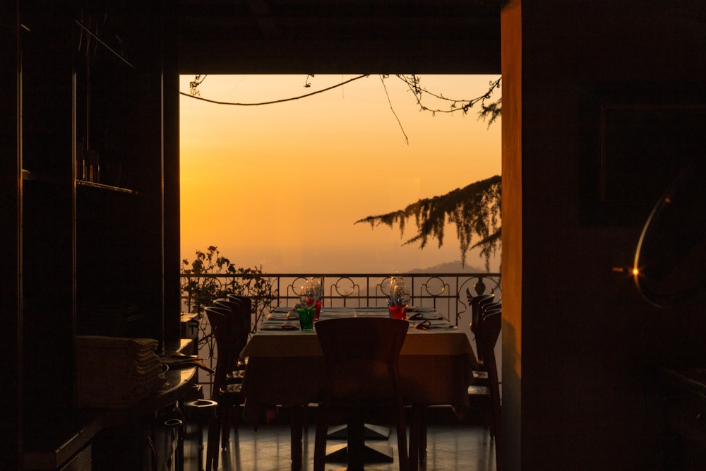 a dining room with a view of the ocean