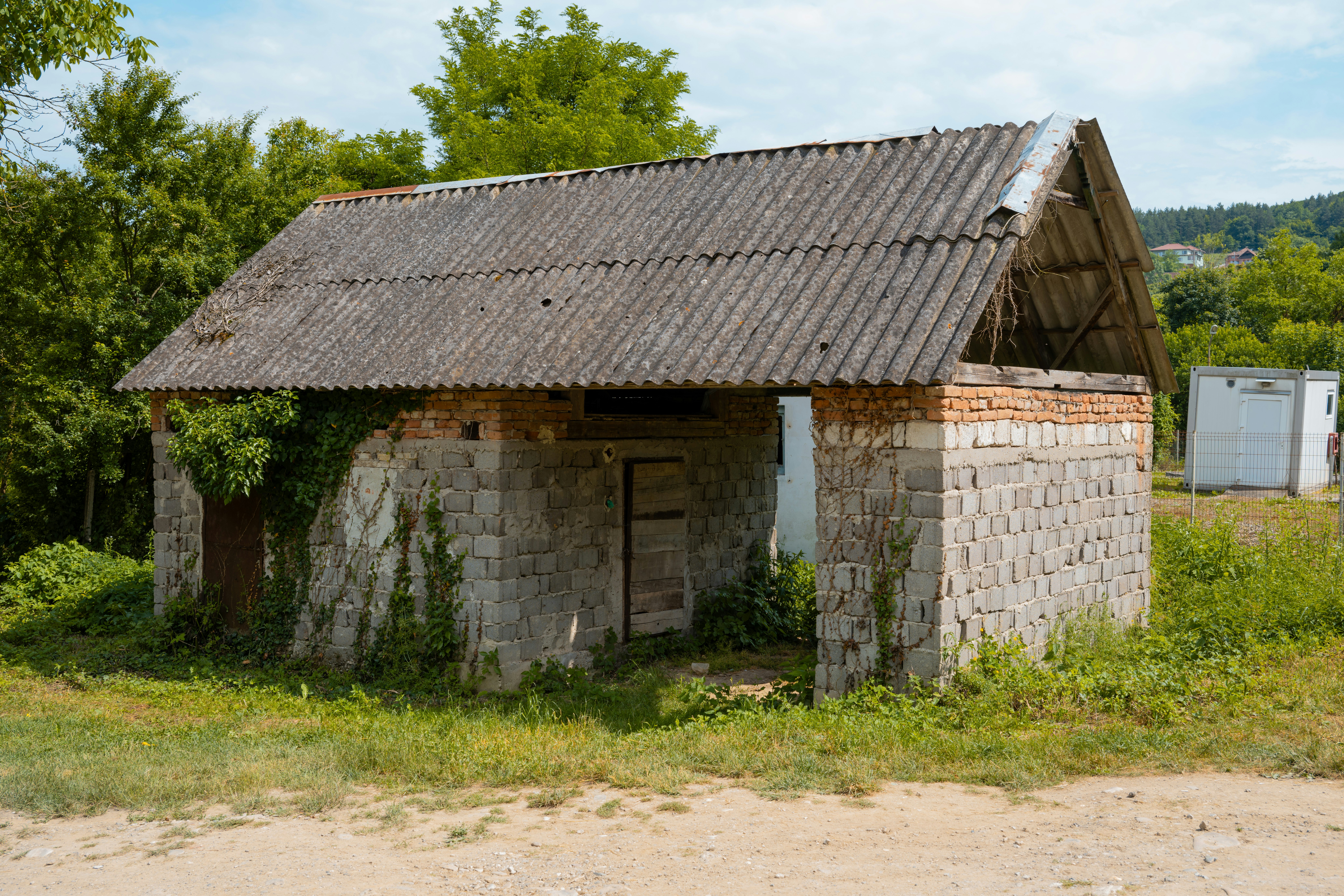 an old brick building with a tiled roof