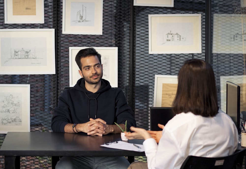 a man and a woman sitting at a table