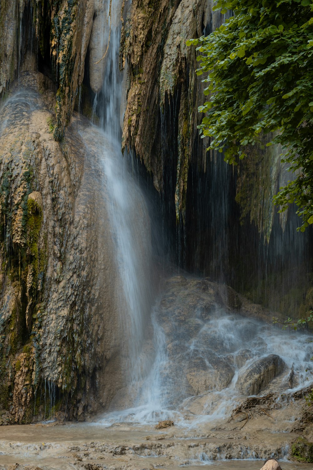 a waterfall with water coming out of it