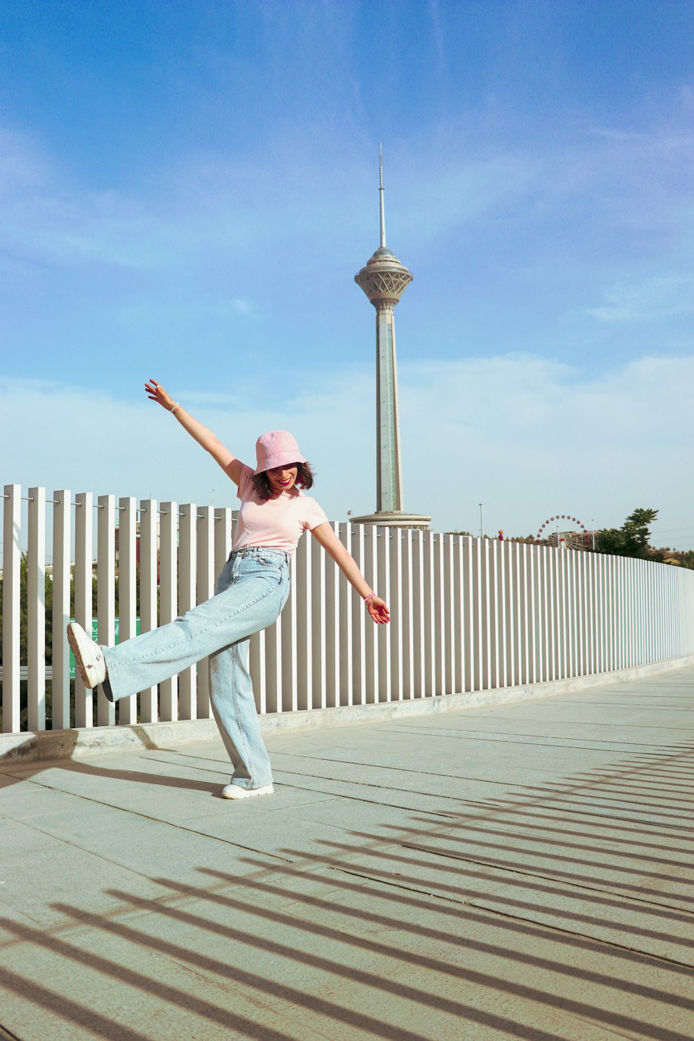 a woman is doing a trick on a skateboard