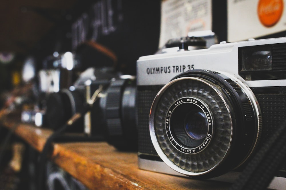 a camera sitting on top of a wooden table