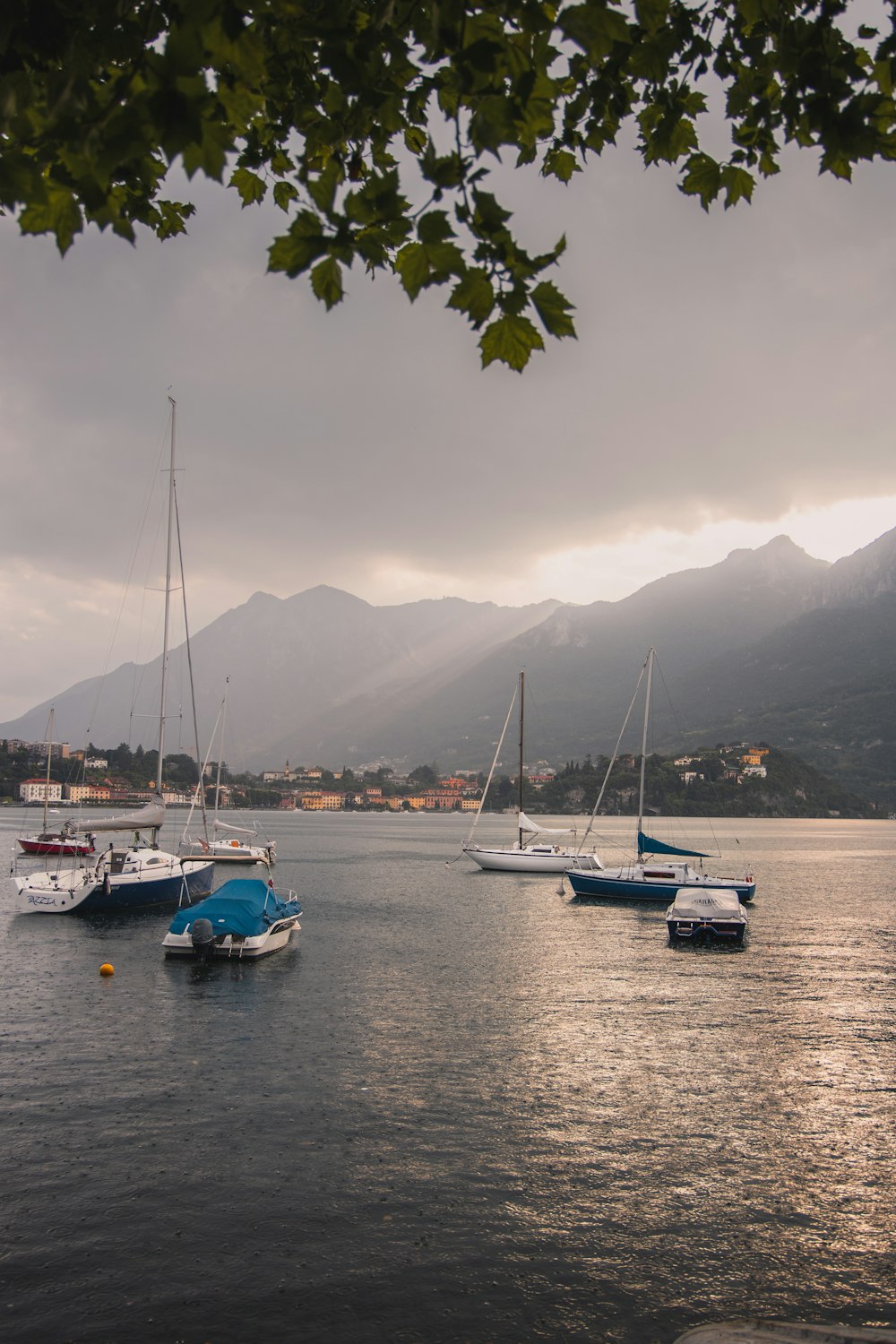 a group of boats floating on top of a body of water