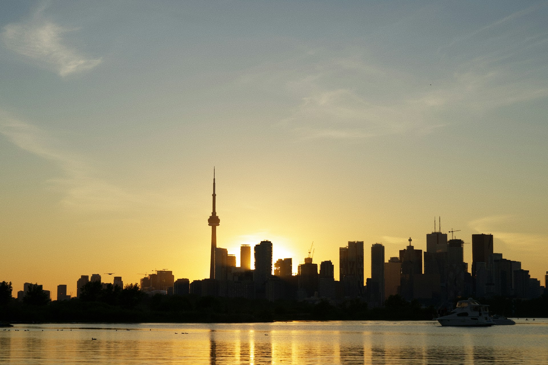 the sun is setting over a large city