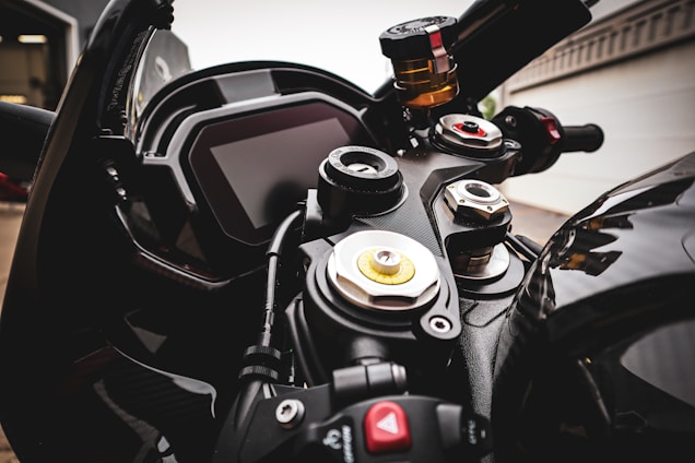 A close-up shot of a motorcycle and a car dashboard, symbolizing automotive passion.