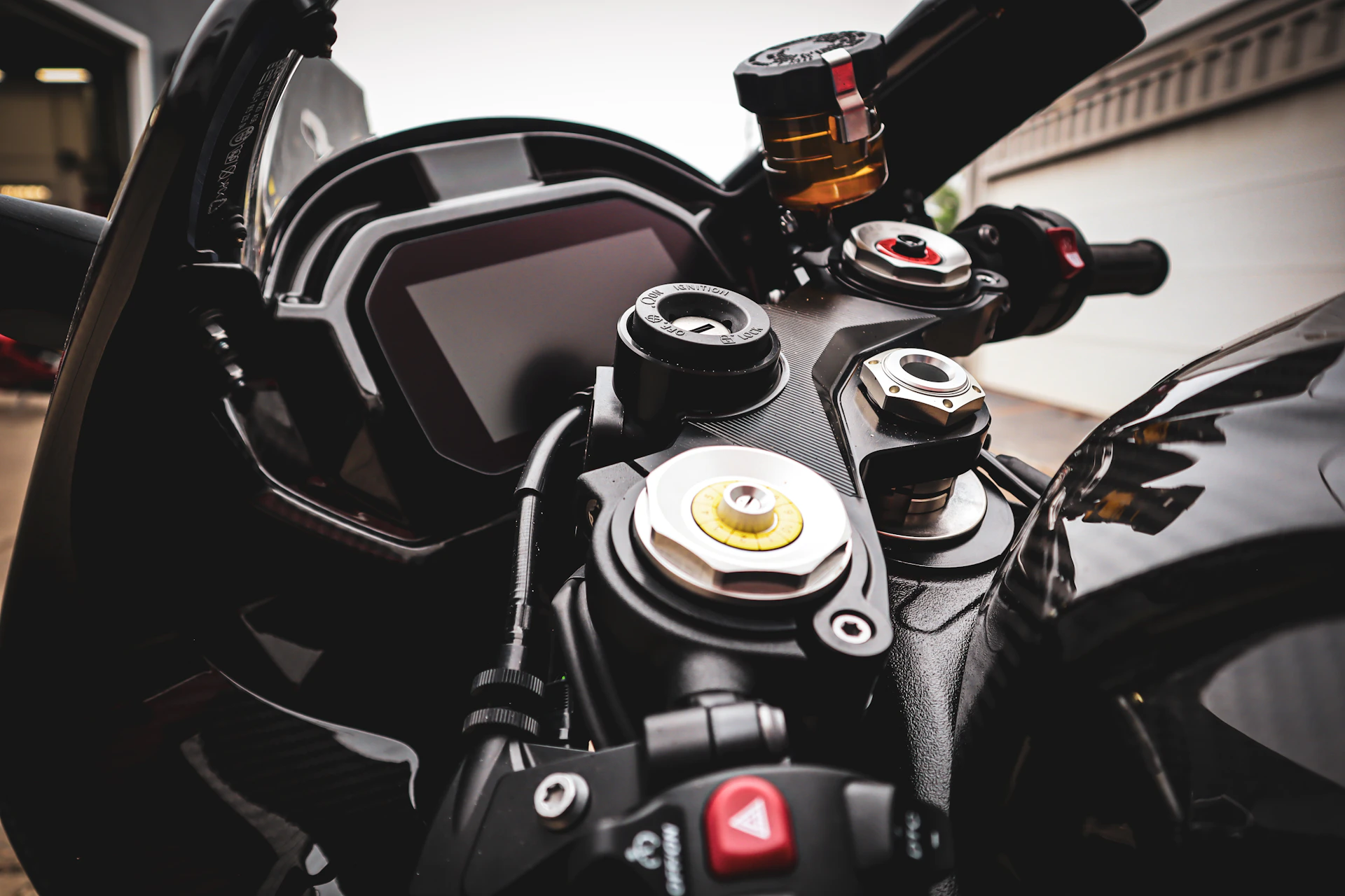 A close-up of a motorcycle's dashboard and handlebars, highlighting the craftsmanship and design.