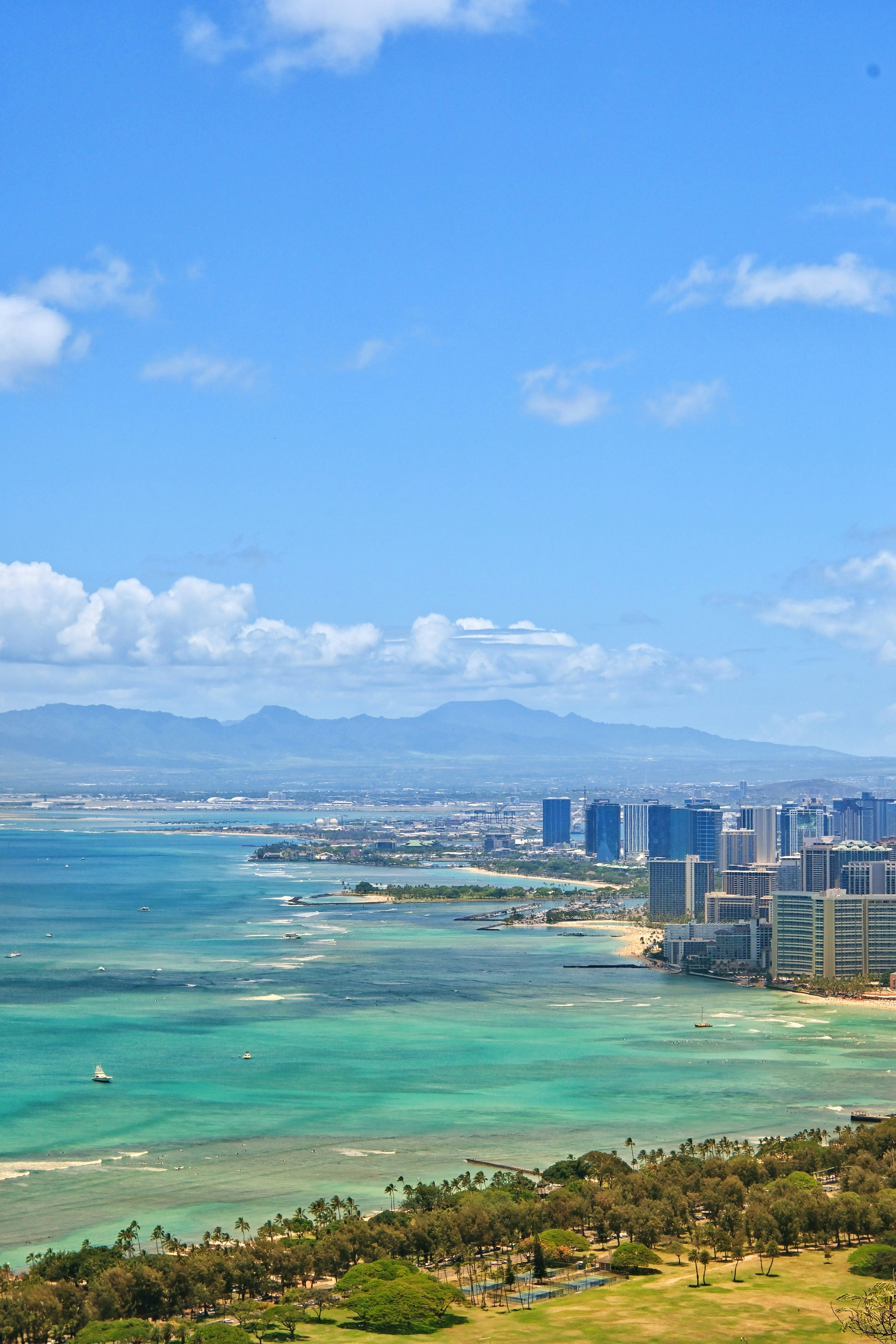 a large body of water with a city in the background