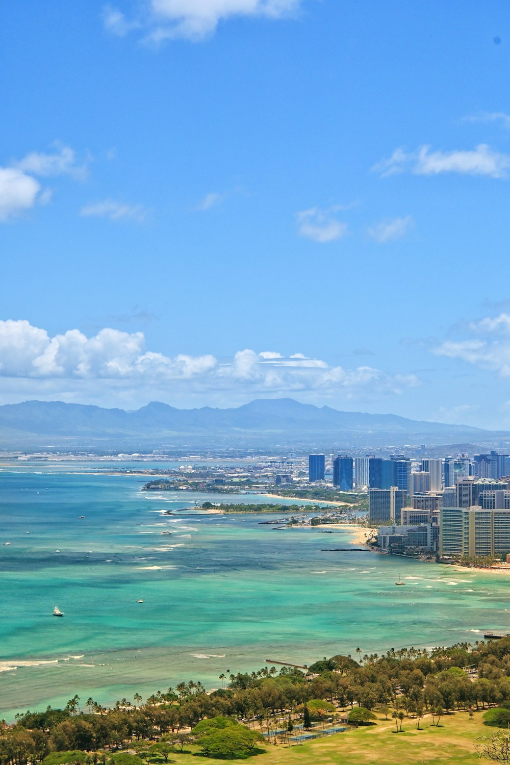 a large body of water with a city in the background