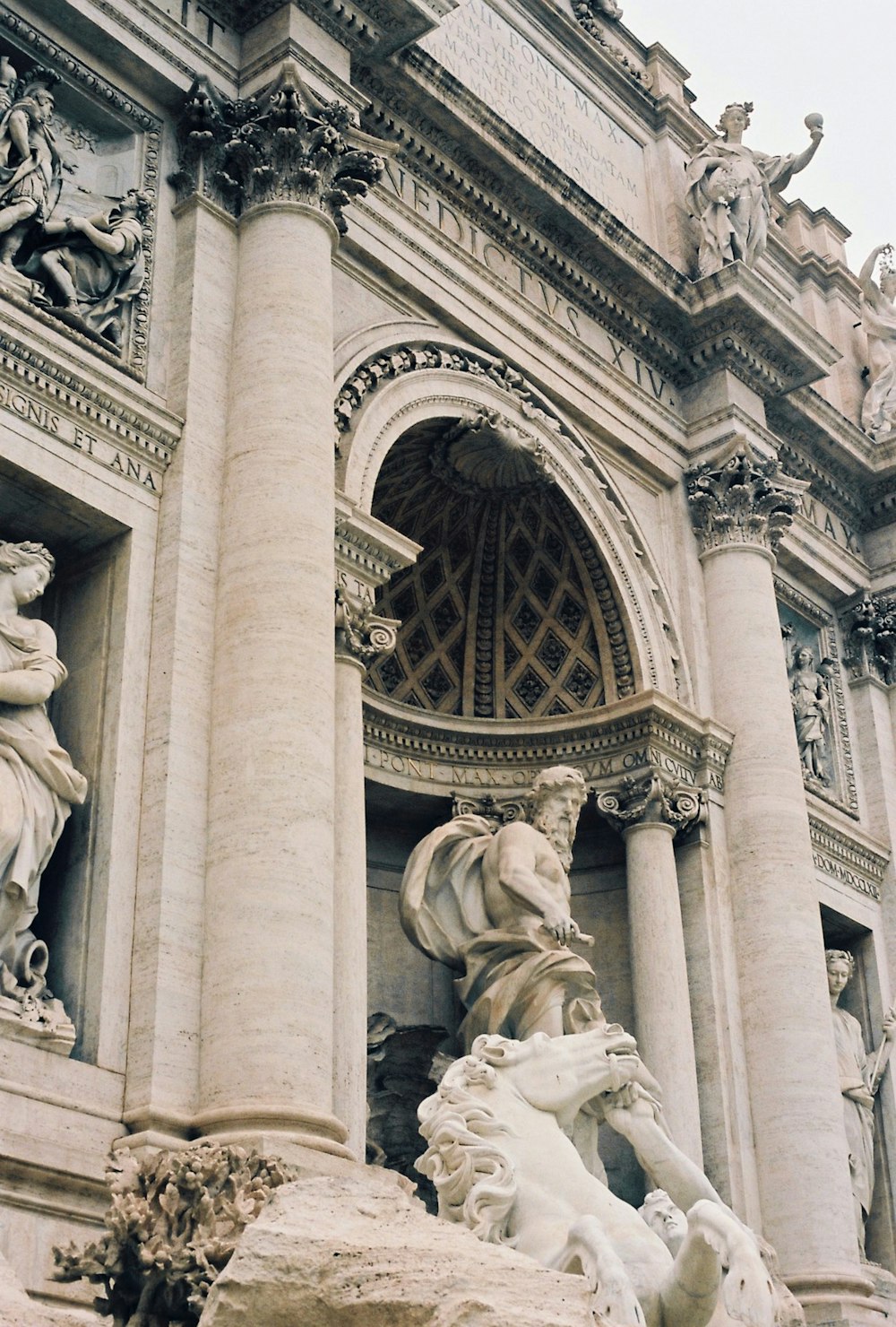 a large building with a fountain in front of it