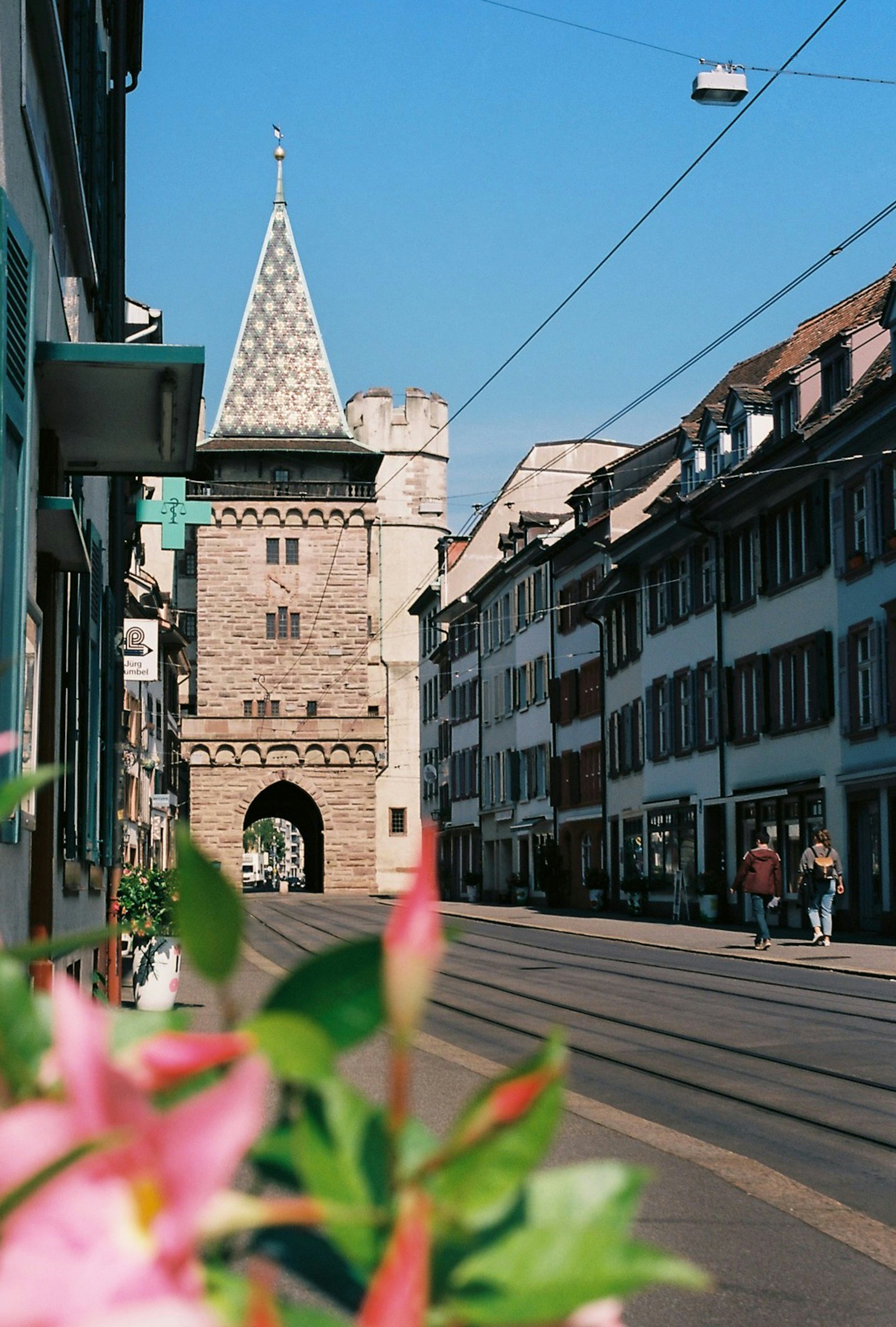 a city street with a clock tower in the background