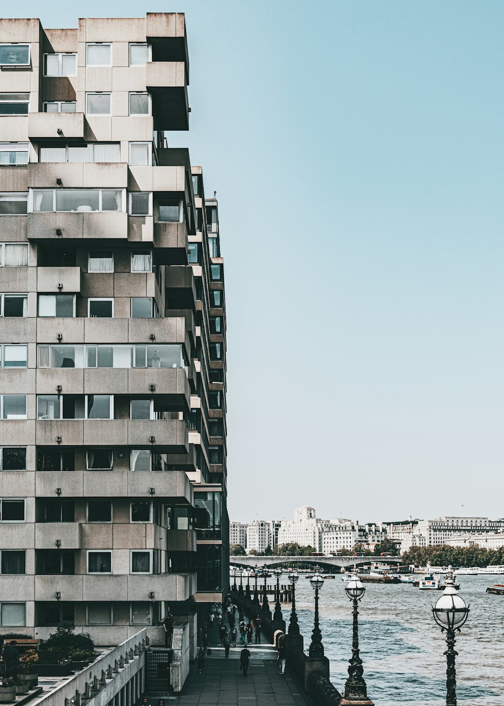 a tall building next to a body of water