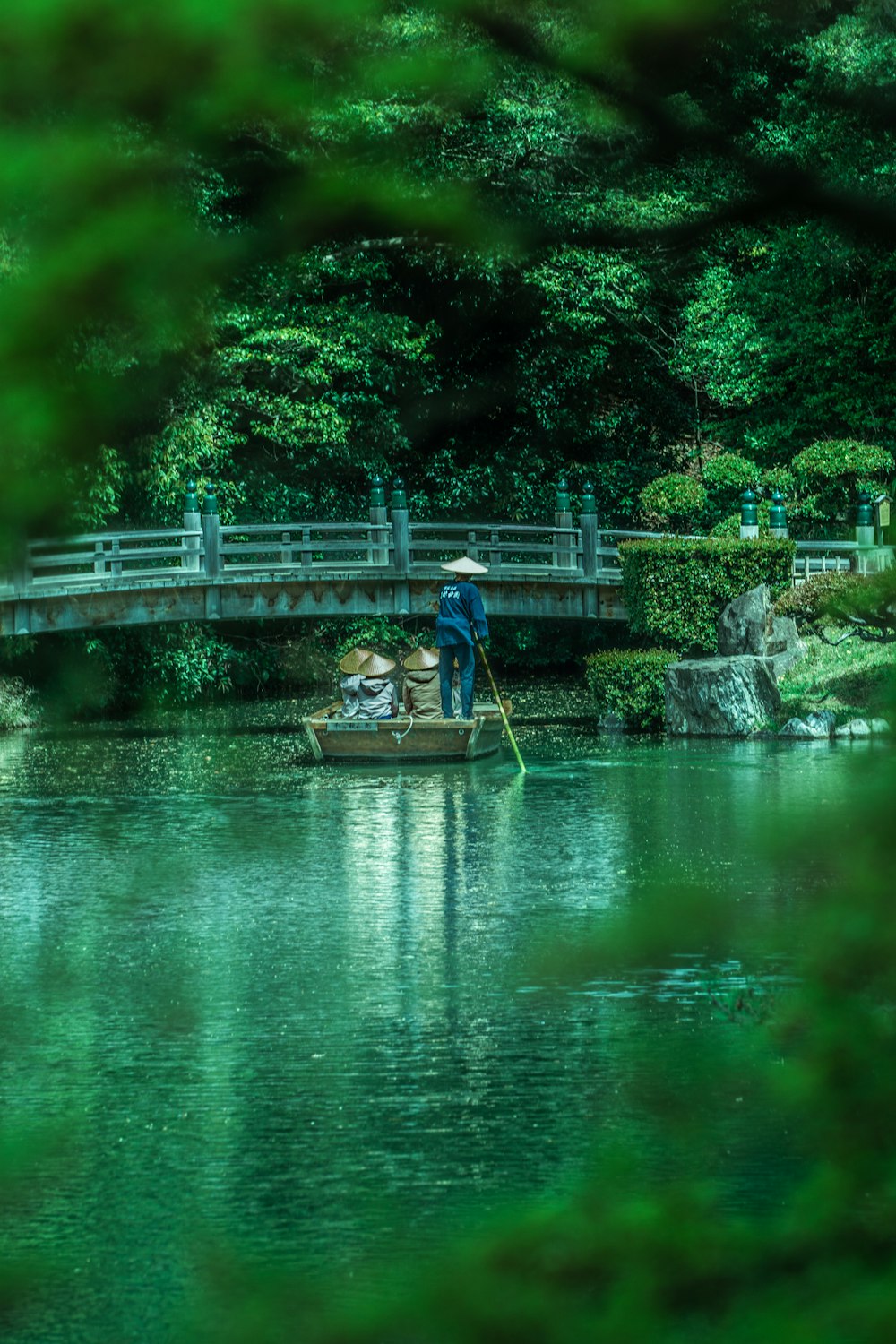 a man in a small boat on a river