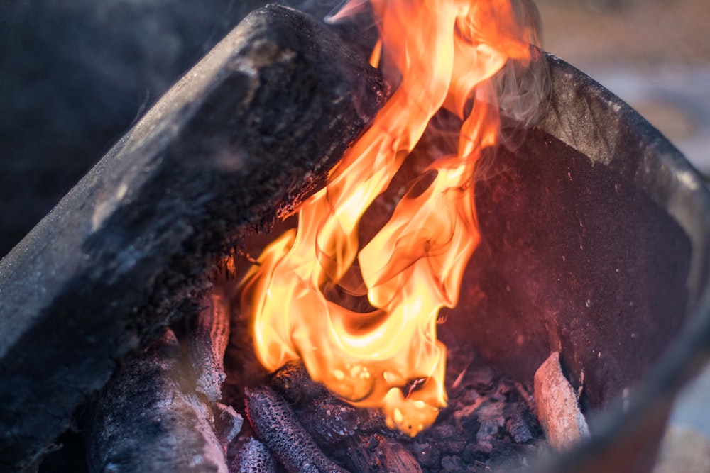 a close up of a fire burning in a pot