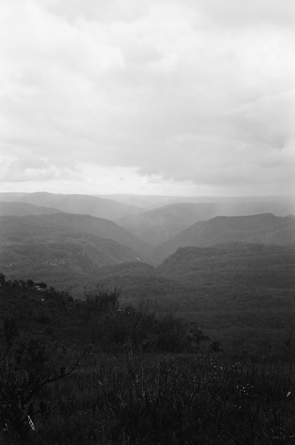 a black and white photo of a mountain range