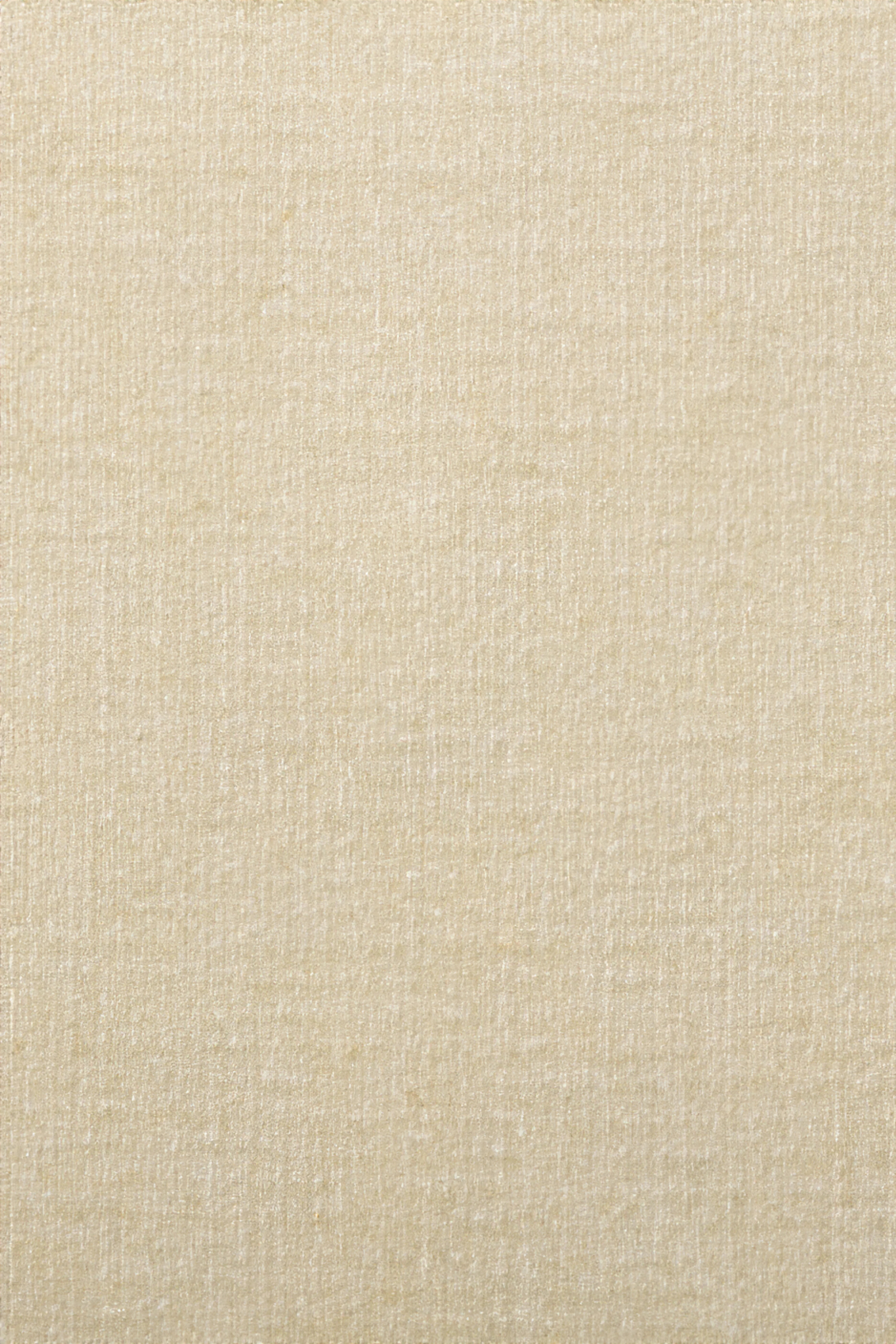 Macro view of a woven cream fabric texture.