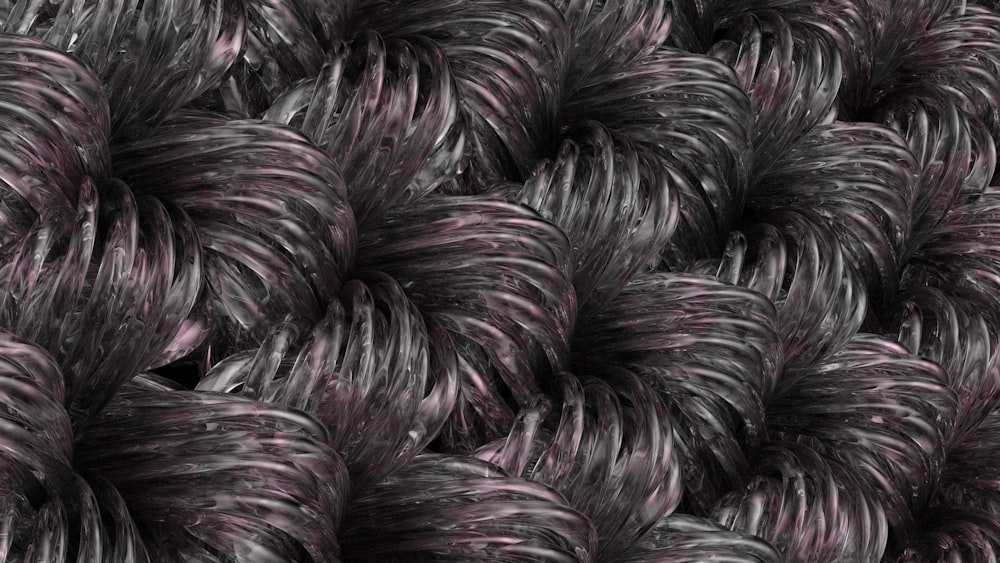 a bunch of black and white balls of yarn