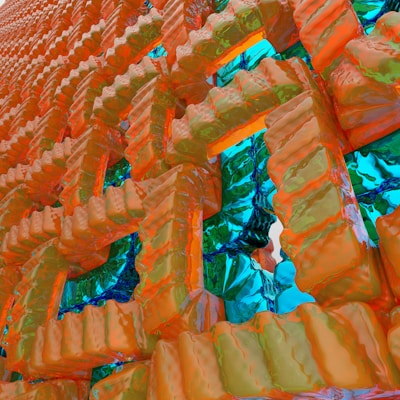 A complex and abstract 3D structure composed of interlocking geometric shapes with a glossy, textured surface. The colors are vibrant with a reflective quality, giving a sense of depth and intricate design.