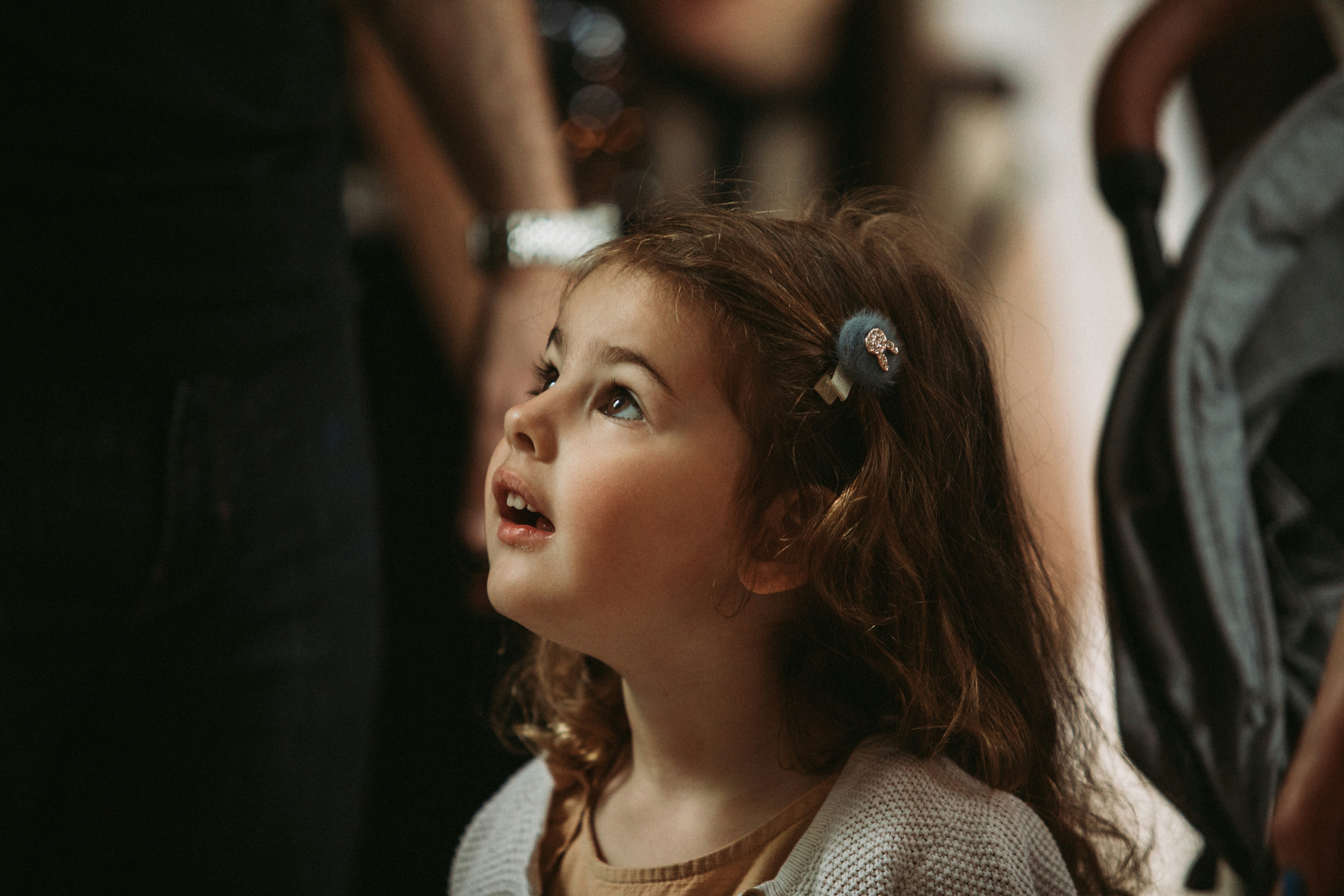 a little girl with a flower in her hair