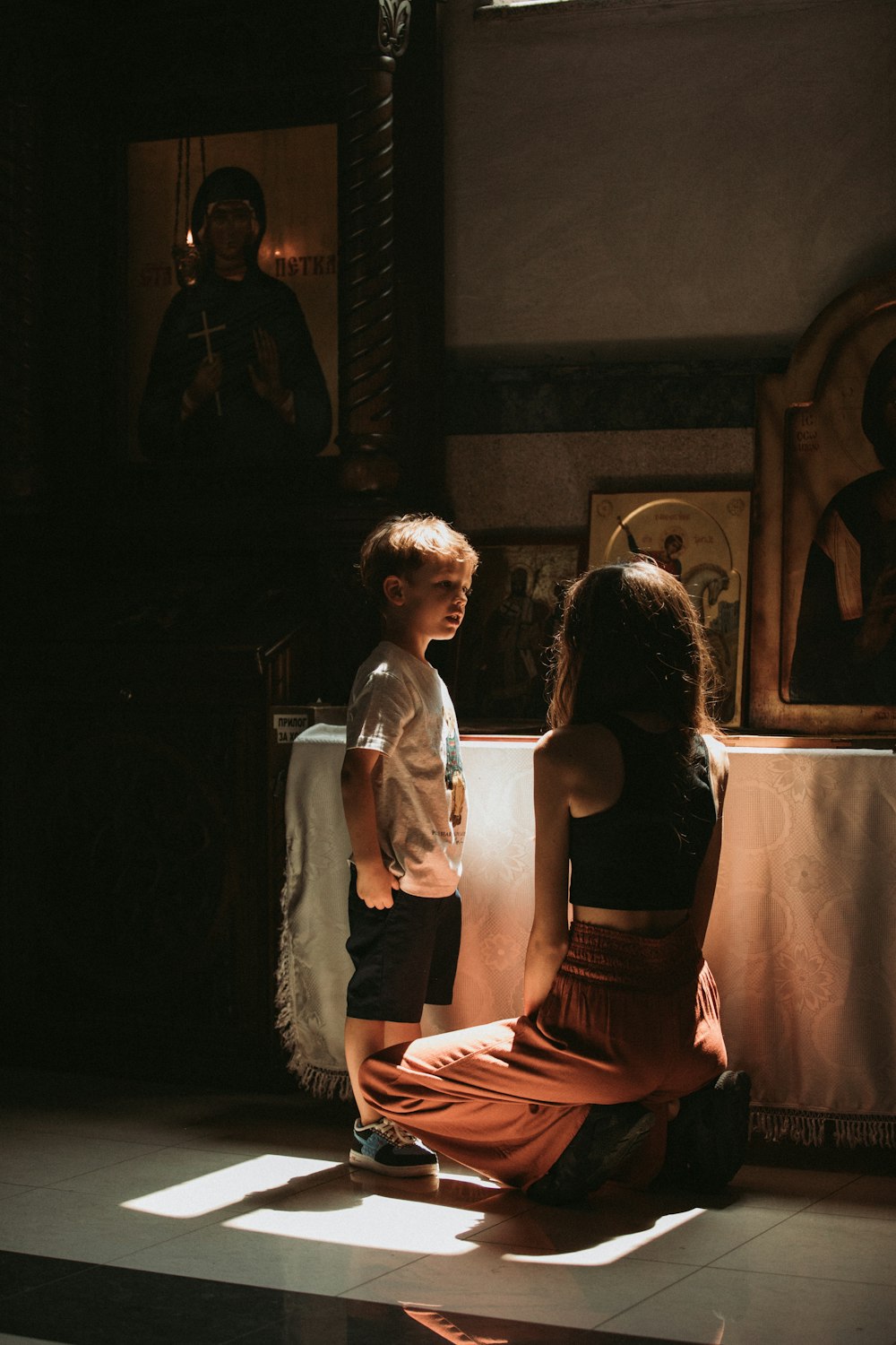 a little boy and a little girl sitting on the floor