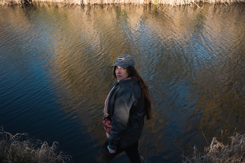 Stylish woman by waterfront