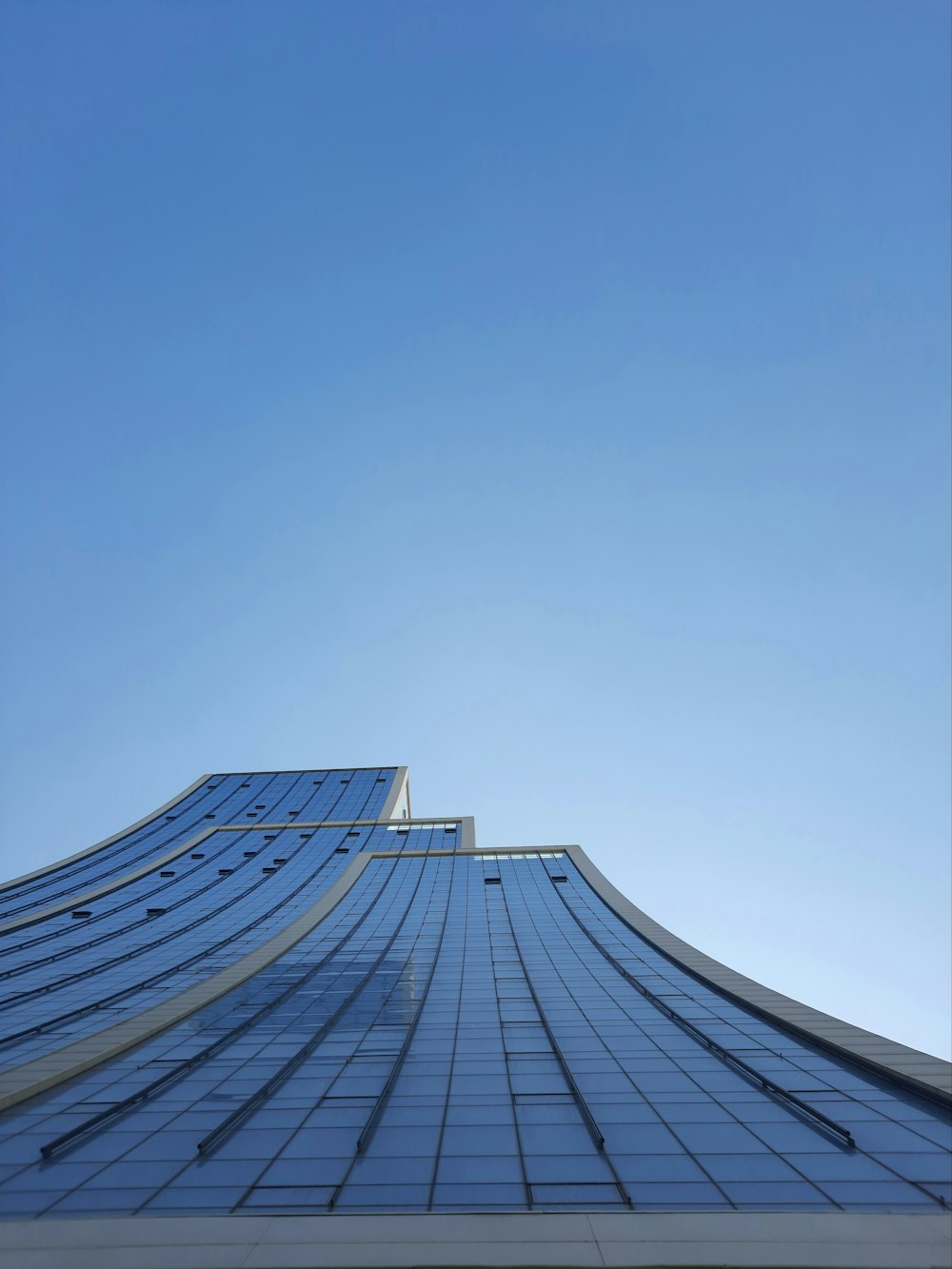 a very tall building with a sky in the background