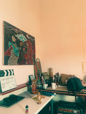 A creative workspace with storyboards and film equipment scattered around, reflecting the energy of a production house.