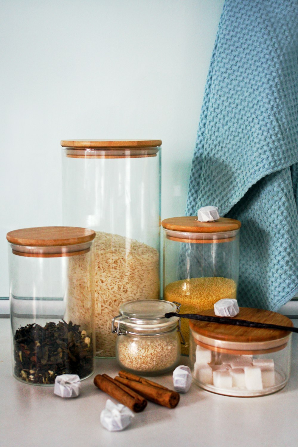 a table topped with jars filled with food