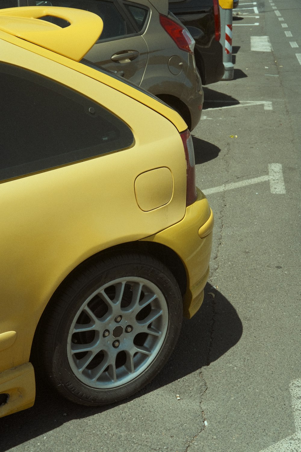 a row of parked cars in a parking lot