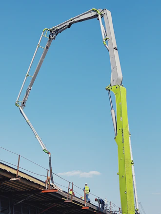 Concrete pump truck operating on a construction site in Brasília.