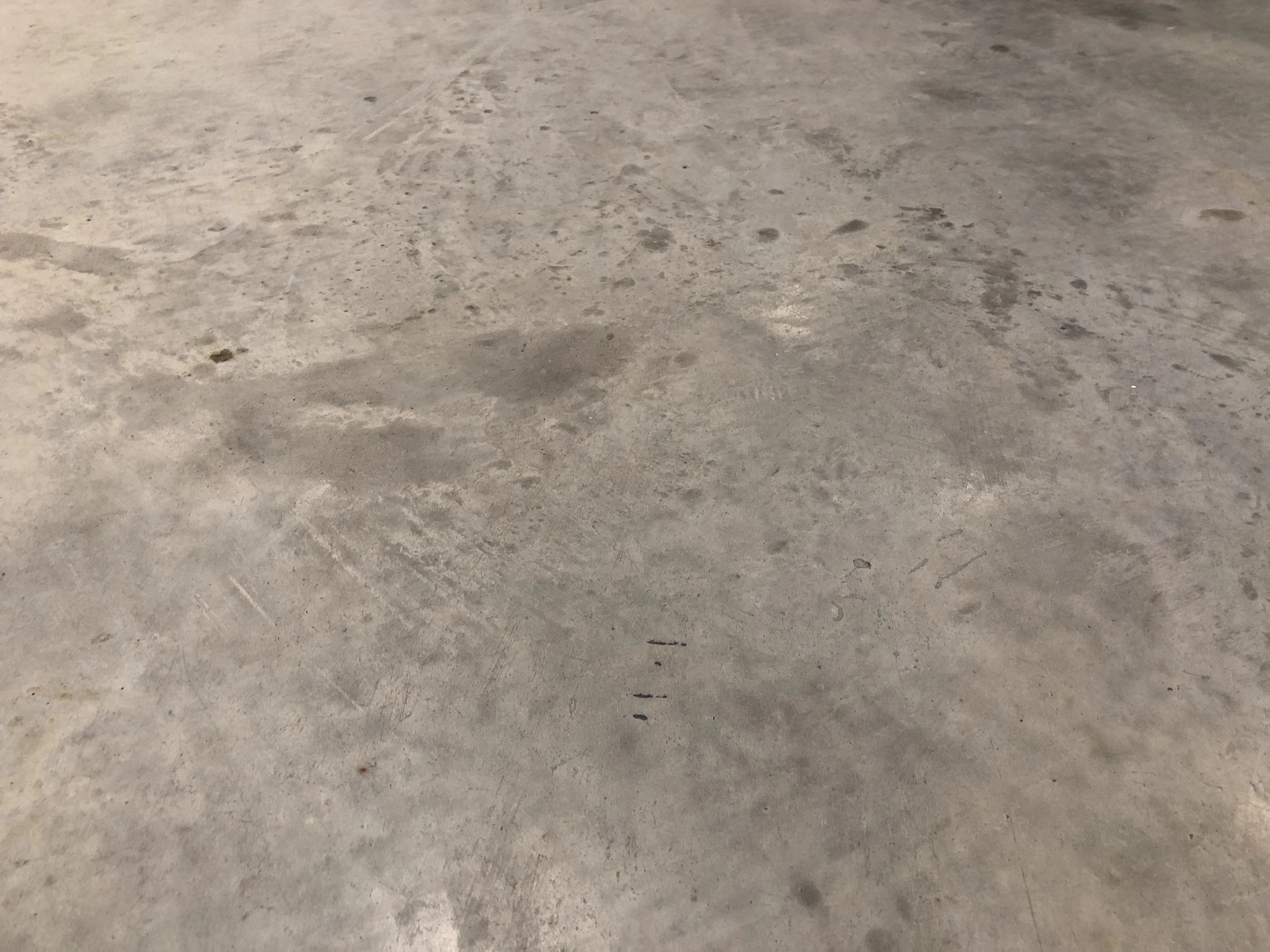 Before: Warehouse floor before and after epoxy coating