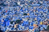 a large group of blue buildings in a city