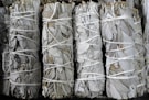 several bundles of white sage tied together