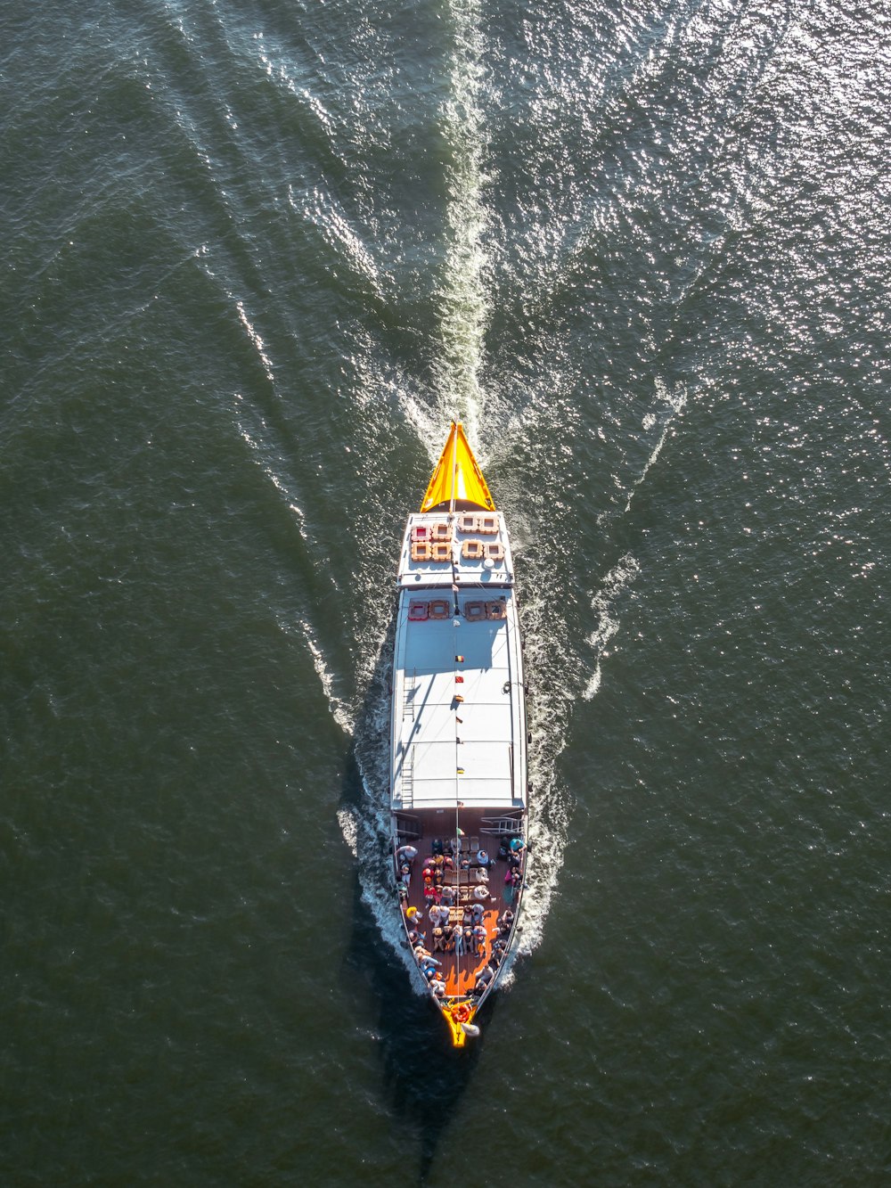 an aerial view of a boat in the water