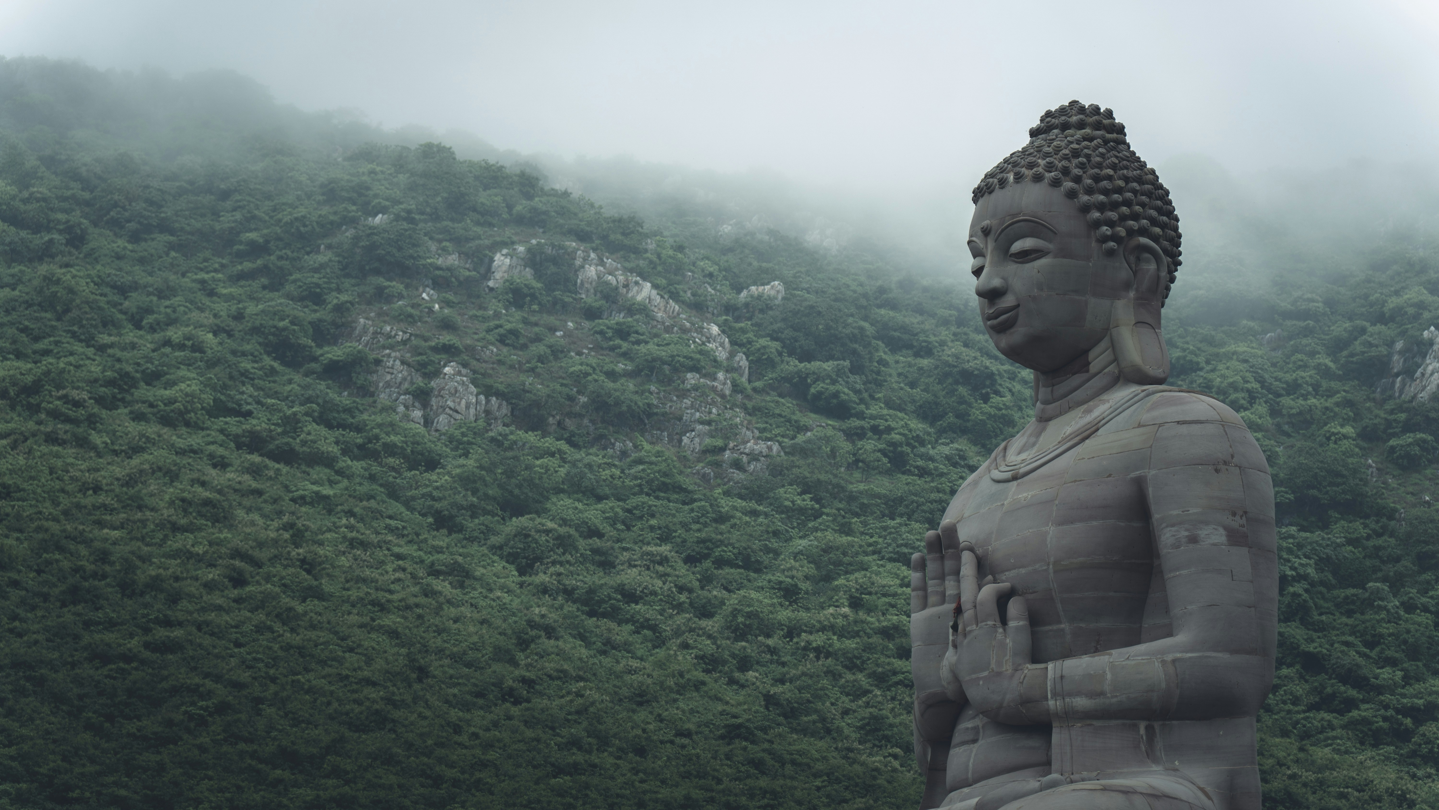 Large Buddha statue in mountain setting