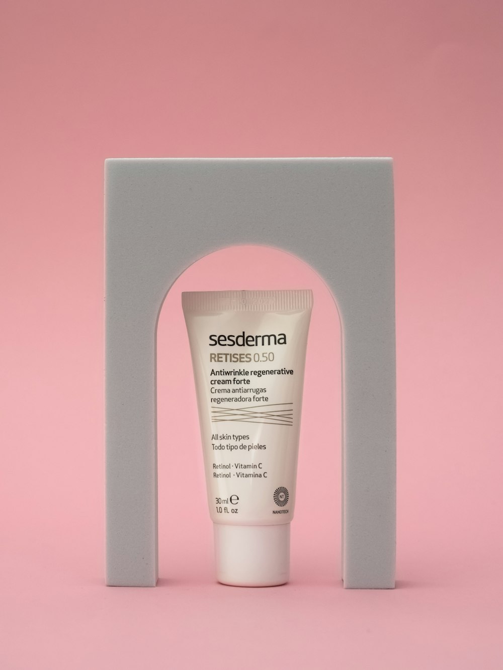 a tube of seedderma on a pink background