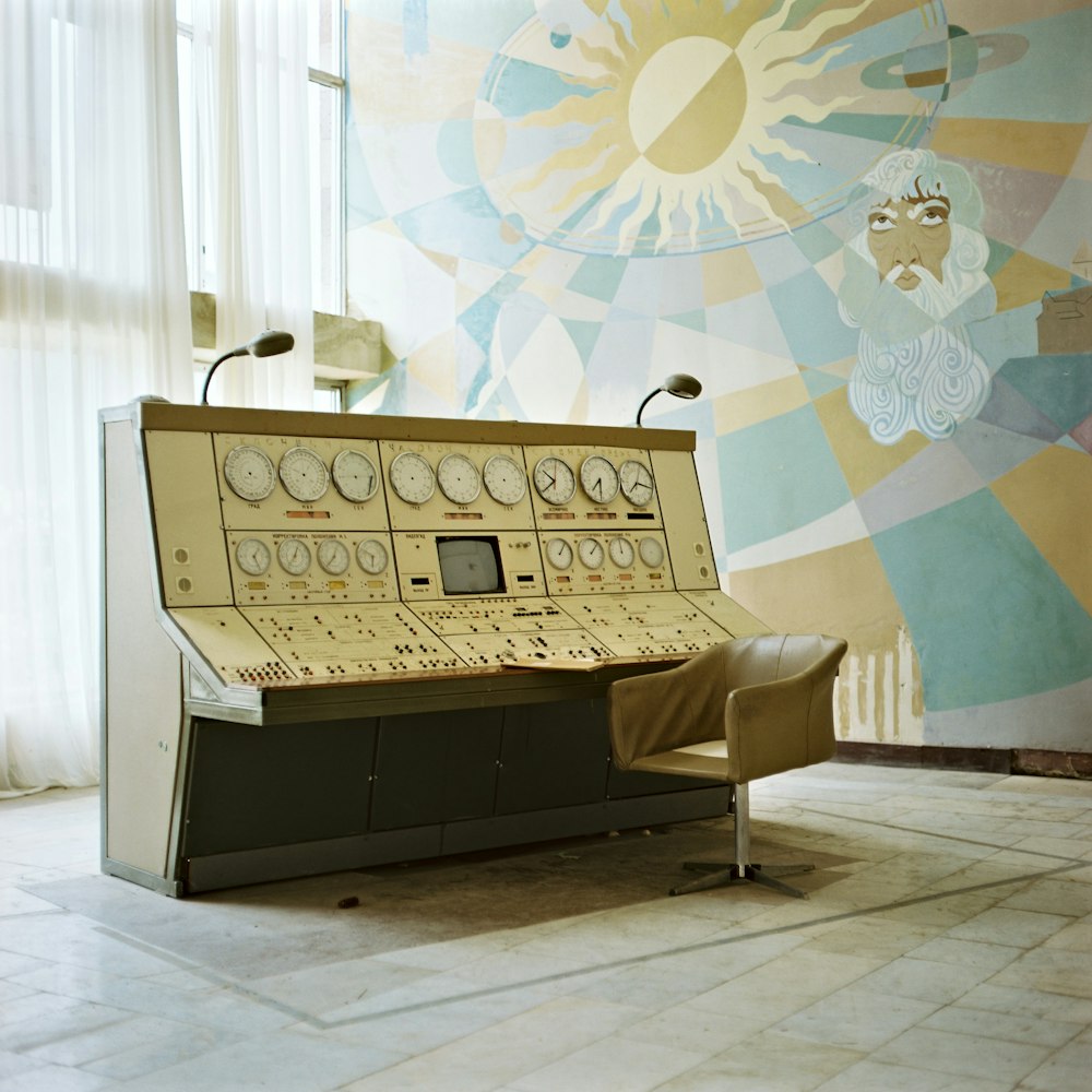 a control panel sitting on top of a tiled floor